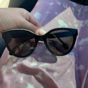 Authentic Chanel butterfly style sunglasses and case.